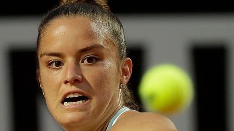 Maria Sakkari, of Greece, returns the ball to Kristina Mladenovic, of France, during a quarterfinal match at the Italian Open, in Rome, Friday, May 17, 2019. (AP Photo/Alessandra Tarantino)