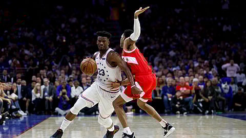 Philadelphia 76ers’ Jimmy Butler, left, tries to get past Toronto Raptors’ Patrick McCaw during the first half of Game 6 of a second-round NBA basketball playoff series on May 9, 2019.