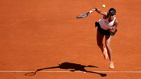 Japan’s Naomi Osaka returns the ball during her match against Slovakia’s Dominika Cibulkova during the Madrid Open tennis tournament, Sunday, May 5, 2019, in Madrid, Spain. (AP Photo/Andrea Comas)