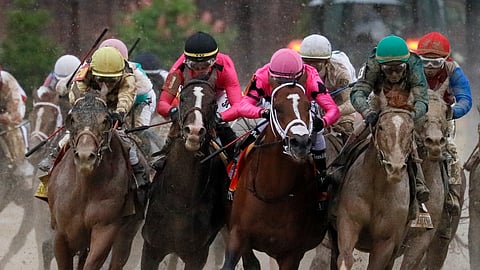 Luis Saez riding Maximum Security, second from right, goes around turn four with Flavien Prat riding Country House, left, Tyler Gaffalione riding War of Will and John Velazquez riding Code of Honor, right, during the 145th running of the Kentucky Derby  at Churchill Downs Saturday, May 4, 2019, in Louisville, Ky. (AP Photo/John Minchillo)