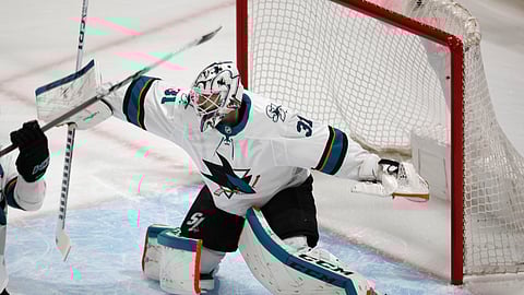 San Jose Sharks goaltender Martin Jones deflects a shot in the first period of Game 6 of an NHL hockey second-round playoff series against the Colorado Avalanche on May 6, 2019.