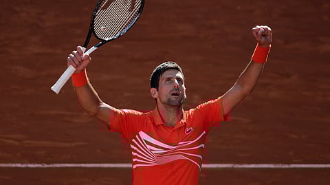 Novak Djokovic celebrates after beating Dominic Thiem in the Madrid Open semis, Saturday, May 11, 2019. (AP Photo/Bernat Armangue)