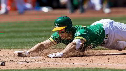 Athletics’ Nick Hundley scores on a triple and error in fifth inning May 11 (John Hefti)