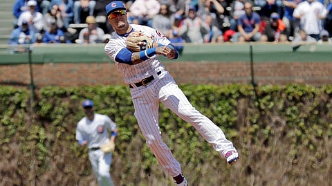 Cubs’ shortstop Javier Baez makes a play in a game on May 10 against the Brewers at Wrigley Field (Nam Y. Huh)