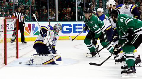 Dallas Stars’ Tyler Seguin (91) scores past St. Louis Blues goaltender Jordan Binnington (50) as Stars’ Roope Hintz (24) watches during the first period of Game 6 on May 5, 2019.