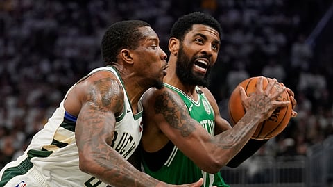 Boston Celtics’ Kyrie Irving tries to drive past Milwaukee Bucks’ Eric Bledsoe during the second half of Game 2 of the second round NBA basketball playoff series on April 30, 2019.