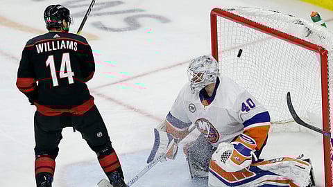 Hurricanes’ Justin Williams scores the game-winning goal against Islanders goalie Robin Lehner in Game 3 of an NHL second-round playoff series in Raleigh, N.C., Wednesday, May 1, 2019. (AP Photo/Gerry Broome)