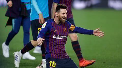 Barcelona forward Lionel Messi celebrates winning the Spanish League title, at the end of the Spanish La Liga soccer match between FC Barcelona and Levante on April 27, 2019.