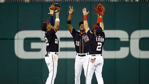 From left to right, Washington Nationals outfielders Juan Soto, Victor Robles and Adam Eaton celebrate after a baseball game against the Miami Marlins, Friday, May 24, 2019, in Washington. (AP Photo/Patrick Semansky)