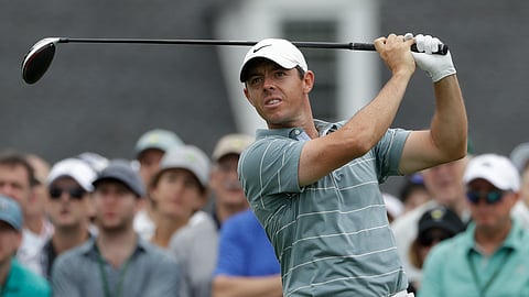 In this April 13, 2019, file photo, Rory McIlroy, of Northern Ireland, hits a drive on the first hole during the third round for the Masters golf tournament, in Augusta, Ga.
