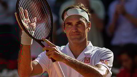 Roger Federer, from Switzerland, celebrates after winning Gael Monfils, from France, during the Madrid Open tennis tournament in Madrid, Spain, Thursday, May 9, 2019. (AP Photo/Bernat Armangue)