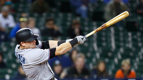 arlins’ Chad Wallach hits an RBI double in the 11th inning on May 21 (Paul Sancya)