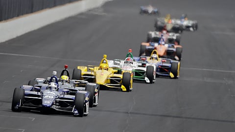 Ed Carpenter leads a group of cars into turn one during the May 24 final practice session for the Indianapolis 500 (Darron Cummings)