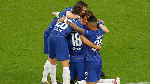 Chelsea’s Olivier Giroud (18) is congratulated by teammates after scoring his team’s first goal on May 29 (Dmitri Lovetsky)