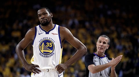 Golden State Warriors’ Kevin Durant, left, is out for the rest of the series against the Houston Rockets. (AP Photo/Ben Margot)
