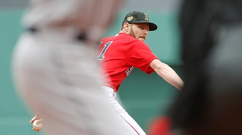 Boston Red Sox starting pitcher Chris Sale delivers against the Houston Astros during the first inning of a baseball game on May 19, 2019, at Fenway Park in Boston.