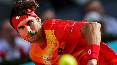 David Ferrer, from Spain, returns the ball to Roberto Bautista, from Spain, during the Madrid Open tennis tournament in Madrid, Tuesday, May 7, 2019. (AP Photo/Bernat Armangue)