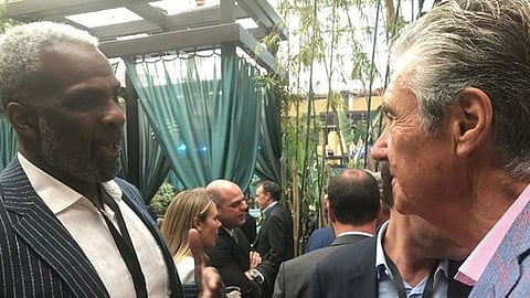 Fromer NBA player Charles Oakley chats with conference organizer Lloyd Levenson (Robert Mims)
