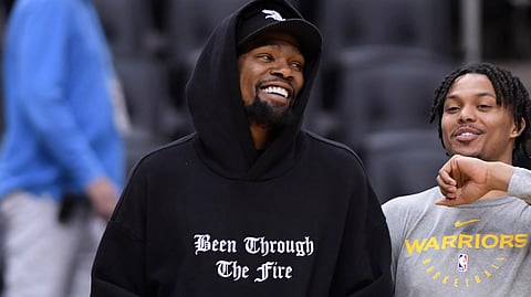 Warriors Kevin Durant (left) laughs with teammate Damion Lee during practice on June 1 (Nathan Denette/The Canadian Press)