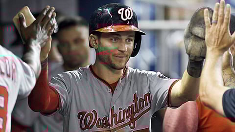 Nationals’ Trea Turner is congratulated by teammates after scoring against the Marlins June 26 (Jim Rassol)