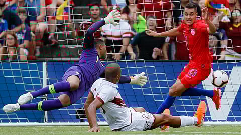 Venezuela forward Jose Salomon Rondon (center) scores against United States goalkeeper Zack Steffen (1) and defender Aaron Long (23) during the first half of an international friendly on June 9 in Cincinnati (John Minchillo)