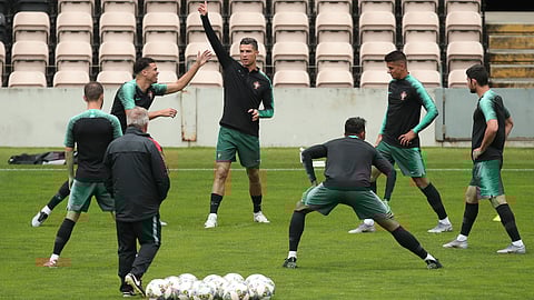 Portugal’s Cristiano Ronaldo (center) gestures during a training session  June 4 (Luis Vieira)