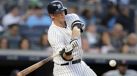 Yankees’ DJ LeMahieu hits an RBI double against the Red Sox on May 31 (Julio Cortez)
