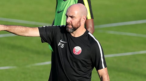 Qatar coach Felix Sanchez gives instructions to his players during a practice session on June 22 (Edison Vara)