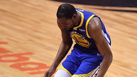Golden State Warriors forward Kevin Durant (35) hobbles after injuring his right leg during first-half basketball action in Game 5 of the NBA Finals against the Toronto Raptors in Toronto, Monday, June 10, 2019.