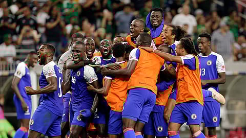 Haiti celebrates a 3-2 win over Canada in a CONCACAF Gold Cup soccer quarterfinal Saturday, June 29, 2019, in Houston. (AP Photo/Michael Wyke)