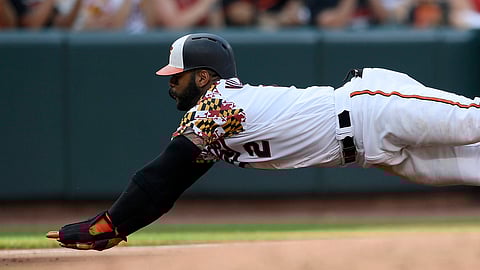 Orioles’ Jonathan Villar dives towards third on a single by Trey Mancini during the third inning on June 29 (Nick Wass)