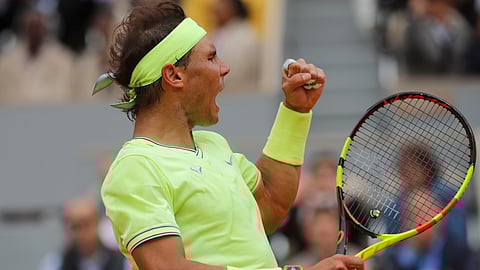 Spain’s Rafael Nadal clenches his fist after scoring a point against Switzerland’s Roger Federer during their semifinal match of the French Open tennis tournament at the Roland Garros stadium in Paris, Friday, June 7, 2019. 