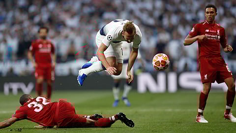 England’s Harry Kane (playing for Tottenham) falls over Liverpool’s Joel Matip during the Champions League final soccer match on June 1 (Bernat Armangue)