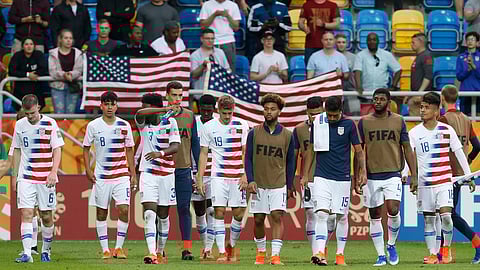 United States players walk on the pitch after their team’s 1-2 loss during the quarter final match between USA and Ecuador at the U20 World Cup soccer in Gdynia, Poland, Saturday, June 8, 2019. (AP Photo/Darko Vojinovic)