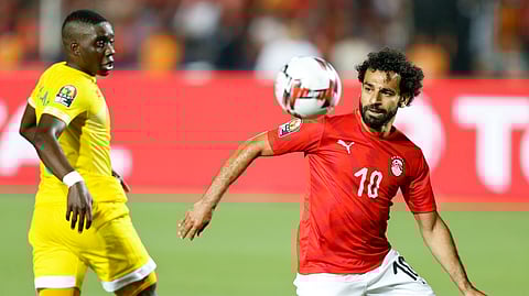 Egypt’s Mohamed Salah runs with the ball during the group A soccer match between Egypt and Zimbabwe, the opening match of the Africa Cup of Nations at Cairo International Stadium in Cairo, Egypt, Friday, June 21, 2019. (AP Photo/Ariel Schalit)