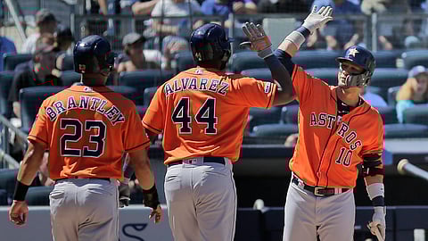 Astros’ Yordan Alvarez (center) celebrates his two-run home run with Yuli Gurriel (right) and Michael Brantley (23) during the fifth inning on June 23 (Seth Wenig)