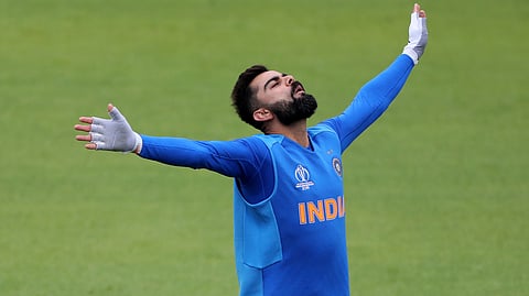 India’s captain Virat Kohli gestures during a training session ahead of their Cricket World Cup match against Pakistan at Old Trafford in Manchester, England, Saturday, June 15, 2019. (AP Photo/Aijaz Rahi) 