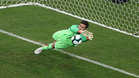 Brazil’s goalkeeper Alison blocks the penalty kick by Paraguay’s Gustavo Gomez during a Copa America quarterfinal soccer match at Arena do Gremio in Porto Alegre, Brazil, Thursday, June 27, 2019. (AP Photo/Ricardo Mazalan)