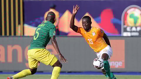 Ivory Coast’s Max Gradel, right, goes for the ball past South Africa’s Thamsanqa Mkhize during the African Cup of Nations group D soccer match between Ivory Coast and South Africa in Al Salam Stadium in Cairo, Egypt, Monday, June 24, 2019. (AP Photo/Hassan Ammar)