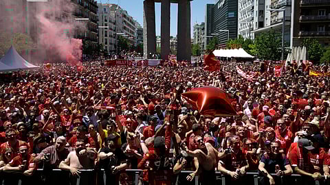 Liverpool supporters gather in a fan zone in downtown Madrid ahead of the Champions League final soccer match between Tottenham Hotspur and Liverpool at the Wanda Metropolitano Stadium in Madrid, Saturday, June 1, 2019. (AP Photo/Andrea Comas)