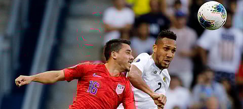United States’ Daniel Lovitz (16) and Panama’ Francisco Palacios have their eyes on the ball during the first half of a CONCACAF Gold Cup soccer match in Kansas City on June 26 (Colin E. Braley)