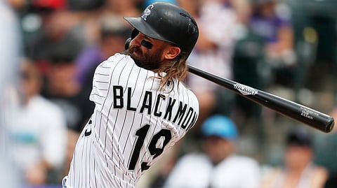 Rockies’ Charlie Blackmon follows through on a single on June 16, the last of his 15 hits in the four-game series with the Padres (David Zalubowski)