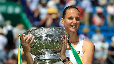Czech player Karolina Pliskova holds the trophy after winning against German Angelique Kerber, during the Ladies’ Singles Final match of the Nature Valley International at Devonshire Park in Eastbourne, England, Saturday June 29, 2019. (Gareth Fuller/PA via AP)
