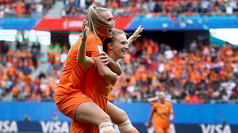 Netherlands’ scorer Vivianne Miedema, right, and her teammate Netherlands’Jill Roord, left, celebrate their side’s 3rd goal during the Women’s World Cup Group E soccer match between the Netherlands and Cameroon at the Stade du Hainaut in Valenciennes, France, Saturday, June 15, 2019. The Netherlands defeated Cameroon by 3-1. (AP Photo/Michel Spingler)