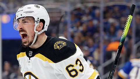 Boston Bruins left wing Brad Marchand (63) celebrates after scoring a goal against the St. Louis Blues during the first period of Game 6 of the NHL hockey Stanley Cup Final Sunday, June 9, 2019, in St. Louis. (AP Photo/Jeff Roberson)