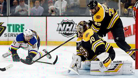 Blues’ Vladimir Tarasenko (left) watches his shot sail puck past Bruins goaltender Tuukka Rask and defenseman Zdeno Chara in Game 2 on May 29 (Michael Dwyer)