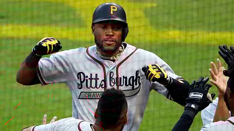Pirates Starling Marte is greeted after hitting a three-run home run on June 1 (Gene J, Puskar)