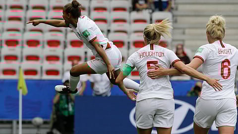 Nikita Parris (left) celebrates after scoring England’s opening goal on a penalty kick on June 9 (Claude Paris)