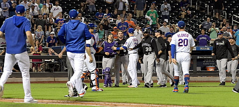 The Mets and Rockies get together to chat during their game on June 7 (Bill Kostroun)