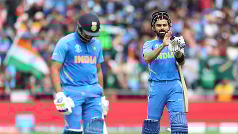 India’s captain Virat Kohli, right, applauds teammate Rohit Sharma, left, as he leaves the field after losing his wicket during the Cricket World Cup match between India and Pakistan at Old Trafford in Manchester, England, Sunday, June 16, 2019. (AP Photo/Aijaz Rahi)
